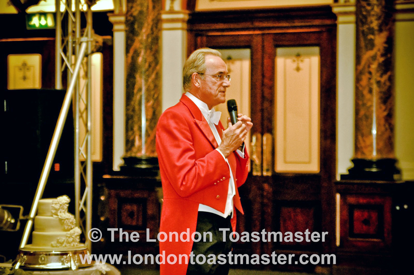 Wedding Toastmaster, Richard Birtchnell, talking to wedding guest as the Master of Ceremonies